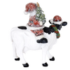Handcrafted 6-inch resin figurine featuring Santa holding a Christmas tree while riding a black and white cow wearing a festive wreath and Santa hat, adding cozy country charm to Home & Decor, Holiday Decor, Best Sellers, and Promo Eligible collections.