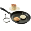 Two handcrafted pancake cooking rings with stay-cool handles used in a black frying pan to make round pancakes, accompanied by a stack of golden cooked pancakes on a white plate, ideal for Kitchen & Food, Kitchen Gadgets, Cooking and Baking Helpers, Best Sellers, and Promo Eligible collections.