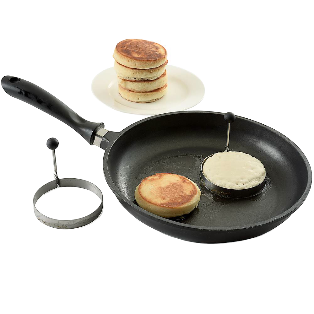Two handcrafted pancake cooking rings with stay-cool handles used in a black frying pan to make round pancakes, accompanied by a stack of golden cooked pancakes on a white plate, ideal for Kitchen & Food, Kitchen Gadgets, Cooking and Baking Helpers, Best Sellers, and Promo Eligible collections.