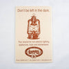 Vintage-style printed card featuring an antique lamp illustration and message promoting non-electric lighting, part of Lehman’s Lamps & Lighting and Best Sellers collections.