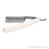 Open straight razor with an off-white handle and finely detailed blade designed for Grooming and Personal Hygiene, Health & Wellness, Best Sellers, and Promo Eligible collections.