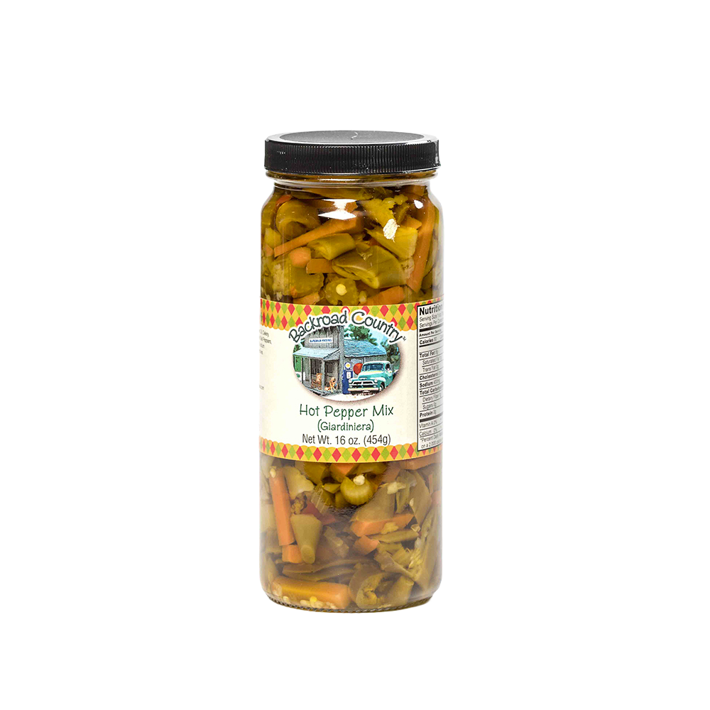 Tall glass jar of handcrafted hot pepper mix with visible chunks of pickled peppers and vegetables, made in USA, ideal for Kitchen & Food, Pantry, and Best Sellers collections at Lehman’s.