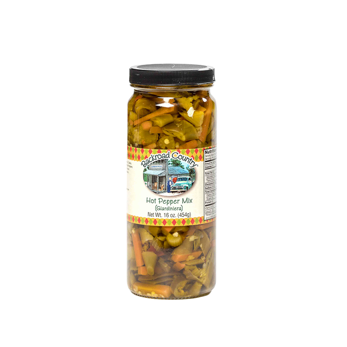 Tall glass jar of handcrafted hot pepper mix with visible chunks of pickled peppers and vegetables, made in USA, ideal for Kitchen & Food, Pantry, and Best Sellers collections at Lehman’s.
