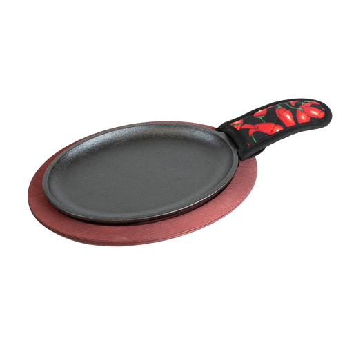 Oval cast iron griddle with red stained wooden underliner and chili pepper patterned handle cover, ideal for cooking fajitas found in Kitchen & Food, Cookware, and Camping collections.
