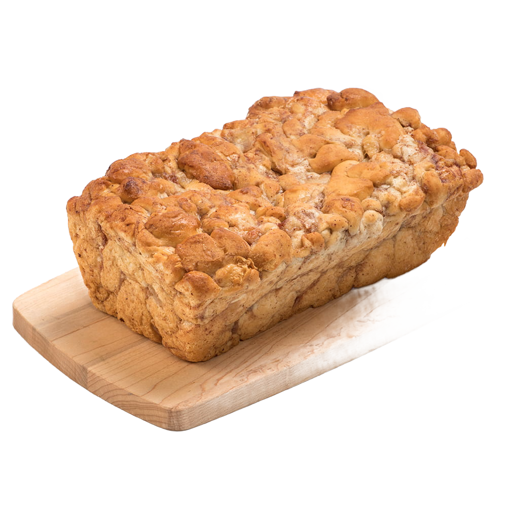 Handcrafted loaf of fresh apple fritter bread with cinnamon and chopped apples, resting on a wooden cutting board, featured in Kitchen & Food, Snacks and Sweets, and USA Made collections.