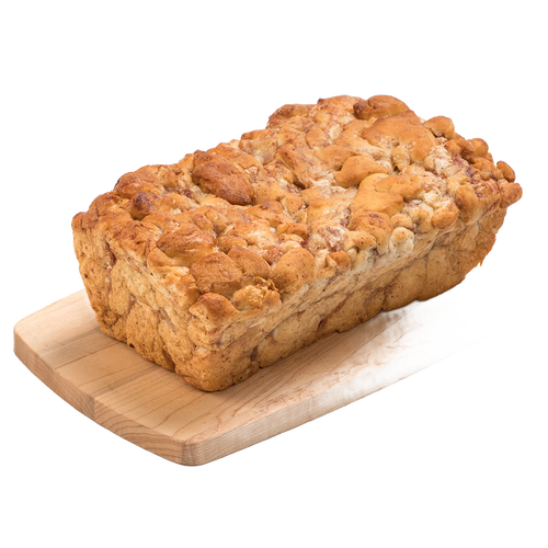 Handcrafted loaf of fresh apple fritter bread with cinnamon and chopped apples, resting on a wooden cutting board, featured in Kitchen & Food, Snacks and Sweets, and USA Made collections.