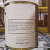 Close-up of a canned freeze-dried cod product label showing preparation instructions, storage advice, ingredient listing, and net weight in a warehouse setting behind shelving.