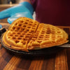 Golden brown heart-shaped waffle freshly made on a pre-seasoned cast iron stovetop waffle maker, suitable for Farm, Garden & Tool and Kitchen & Food collections.