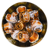 Top view of freeze-dried cinnamon rolls with visible swirls and glaze inside a metal container, crafted in the USA and featured in Kitchen & Food and Emergency Supplies collections.