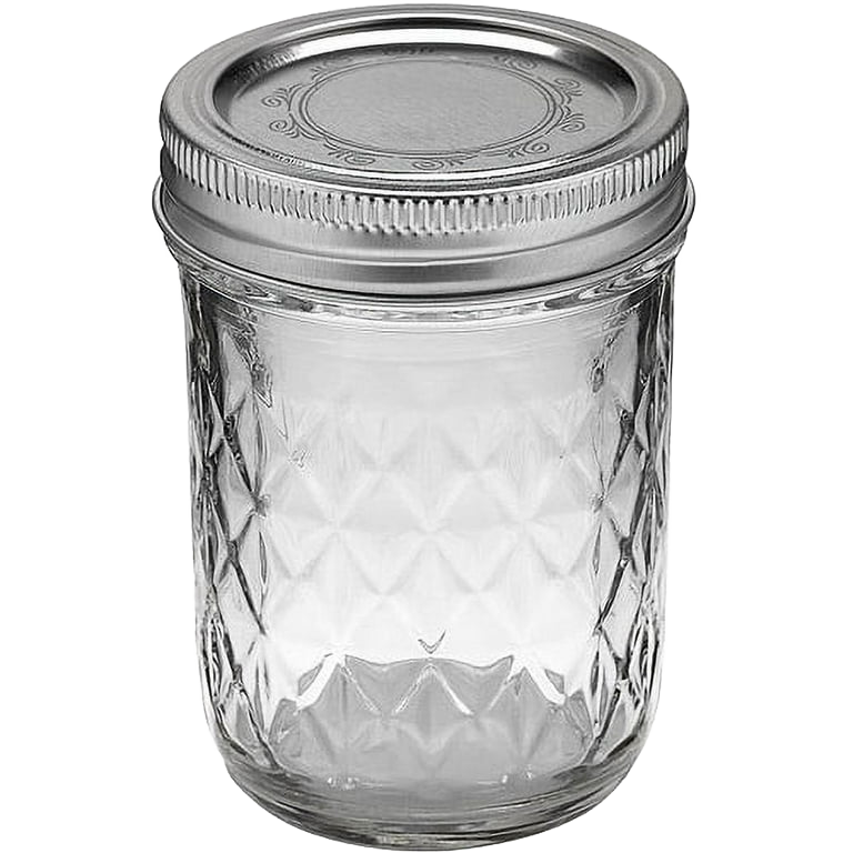 Handcrafted clear glass jar with quilted pattern and regular metal lid, designed for food preservation and canning, featured in Kitchen & Food, USA Made, and Best Sellers collections.