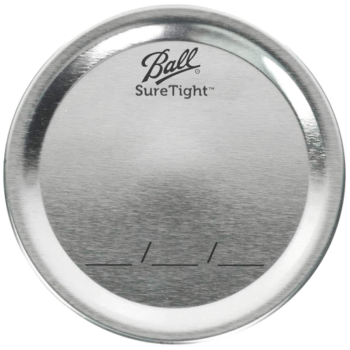 Silver-toned metal canning lid with Ball SureTight logo and date marking lines, designed for food preservation, part of Kitchen & Food and USA Made collections.