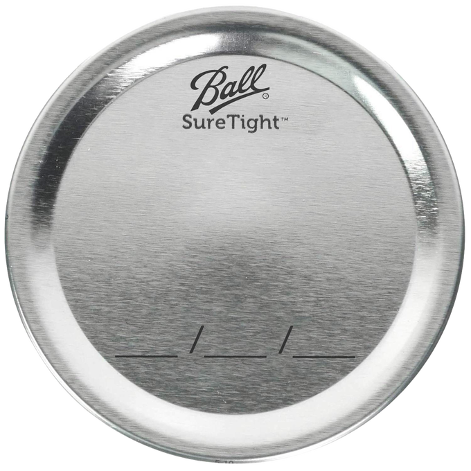 Silver-toned metal canning lid with Ball SureTight logo and date marking lines, designed for food preservation, part of Kitchen & Food and USA Made collections.