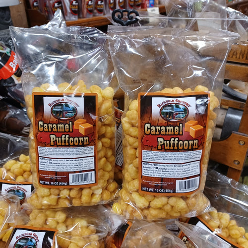 Two clear bags filled with golden caramel-coated puffcorn with rich caramel squares on the labels, featured in Kitchen & Food, Snacks and Sweets, USA Made, and Best Sellers collections.