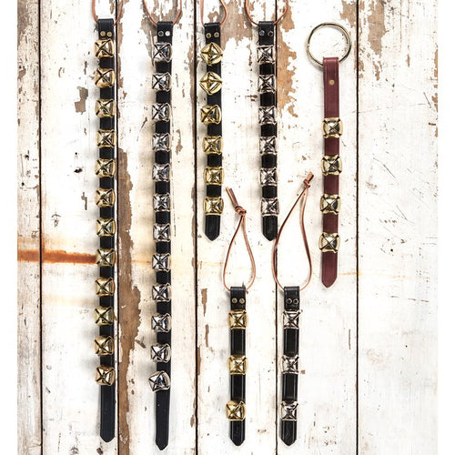 Assortment of handcrafted sleigh bell door hangers featuring brass and silver bells on black and brown leather straps with leather ties, ideal for holiday decor, USA Made, and best sellers in Home & Decor.