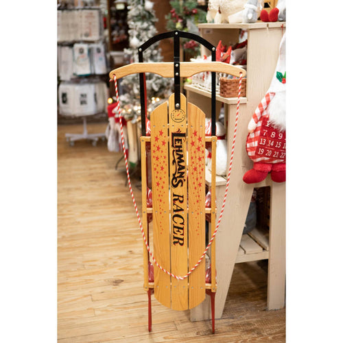 Handcrafted Amish made solid oak sled with red metal runners and twisted rope handles, featuring a vintage-style speedometer decal, ideal for outdoor play and children's toys in USA Made and Best Sellers collections.