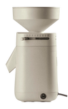 Beige electric stone grain mill with a wide top hopper and adjustable settings lever, designed for effortless home flour milling, featured in Kitchen & Food and Grain Mills collections.