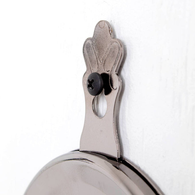 Close-up of a polished metal wall bracket with a decorative top and black screw, part of a handcrafted Lehman's Woodshed Wall Mounted Oil Lamp in Lamps & Lighting and Wall Lamps collections.