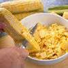 Handcrafted high-carbon steel steak and utility knife with satin-finished recycled aluminum handle slicing corn kernels into a white bowl, featured in Kitchen & Food and Farm collections.