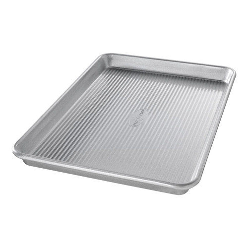 Durable aluminized steel quarter sheet pan with raised edges and ribbed base, designed for versatile baking and cooking, featured in Kitchen & Food, Cookware, and USA Made collections.