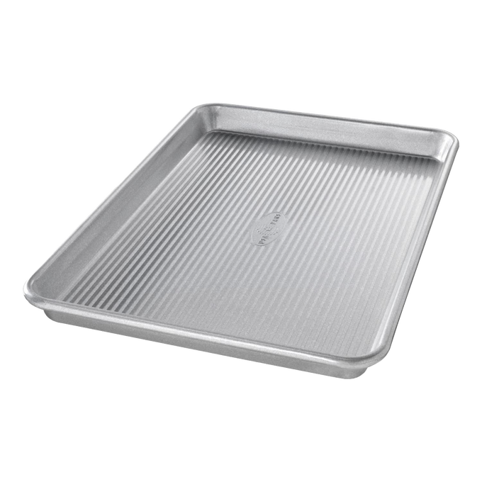 Durable aluminized steel quarter sheet pan with raised edges and ribbed base, designed for versatile baking and cooking, featured in Kitchen & Food, Cookware, and USA Made collections.