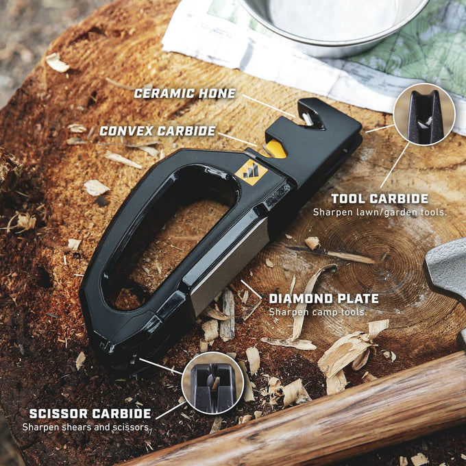 Black compact sharpener with ergonomic handle featuring ceramic hone, convex carbide, tool carbide, diamond plate, and scissor carbide edges, designed for quick sharpening of knives, garden, and camp tools, showcased on a wooden surface with natural outdoor elements, fitting Farm, Garden & Tool, Kitchen & Food, Hand Tools and Hardware, Sharpening, and Best Sellers collections.