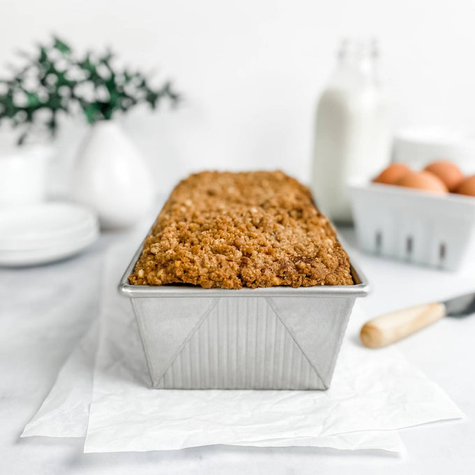 Large loaf with crumb topping baked in a sturdy recycled steel pan featuring corrugated texture for strength and even cooking, ideal for Kitchen & Food and Baking Supplies collections.
