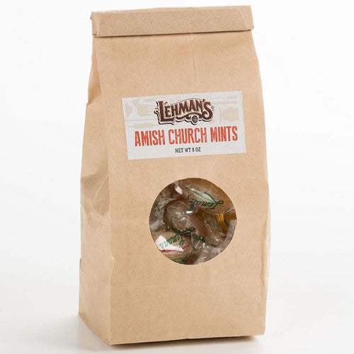 Brown paper bag of handcrafted Amish-made mints with a clear window showing individually wrapped candies, featured in Kitchen & Food, Snacks and Sweets, and USA Made collections.