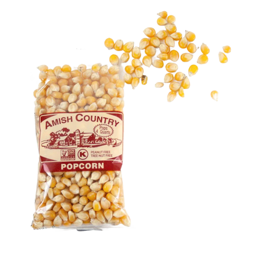 Clear bag of handcrafted Amish Country yellow popcorn kernels spilling onto a white background, featured in Kitchen & Food, Snacks and Sweets, Popcorn, and USA Made collections.