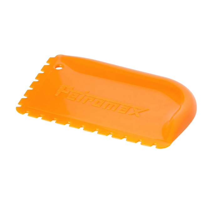Orange pan scraper with textured edges and curved grip, designed for safely cleaning cast iron cookware, featured in Kitchen & Food, Cookware, Cast Iron, and Best Sellers collections.