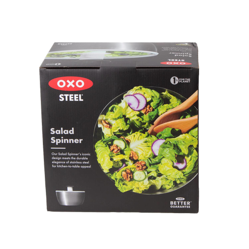 Box packaging for a stainless steel salad spinner featuring a fresh mixed green salad with walnuts, radishes, and cucumbers, ideal for kitchen gadgets and best sellers collections.