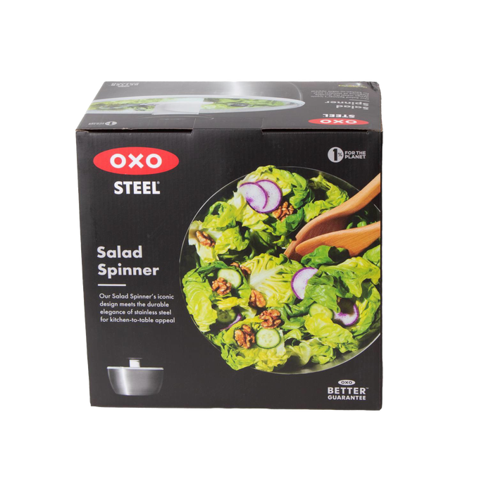 Box packaging for a stainless steel salad spinner featuring a fresh mixed green salad with walnuts, radishes, and cucumbers, ideal for kitchen gadgets and best sellers collections.