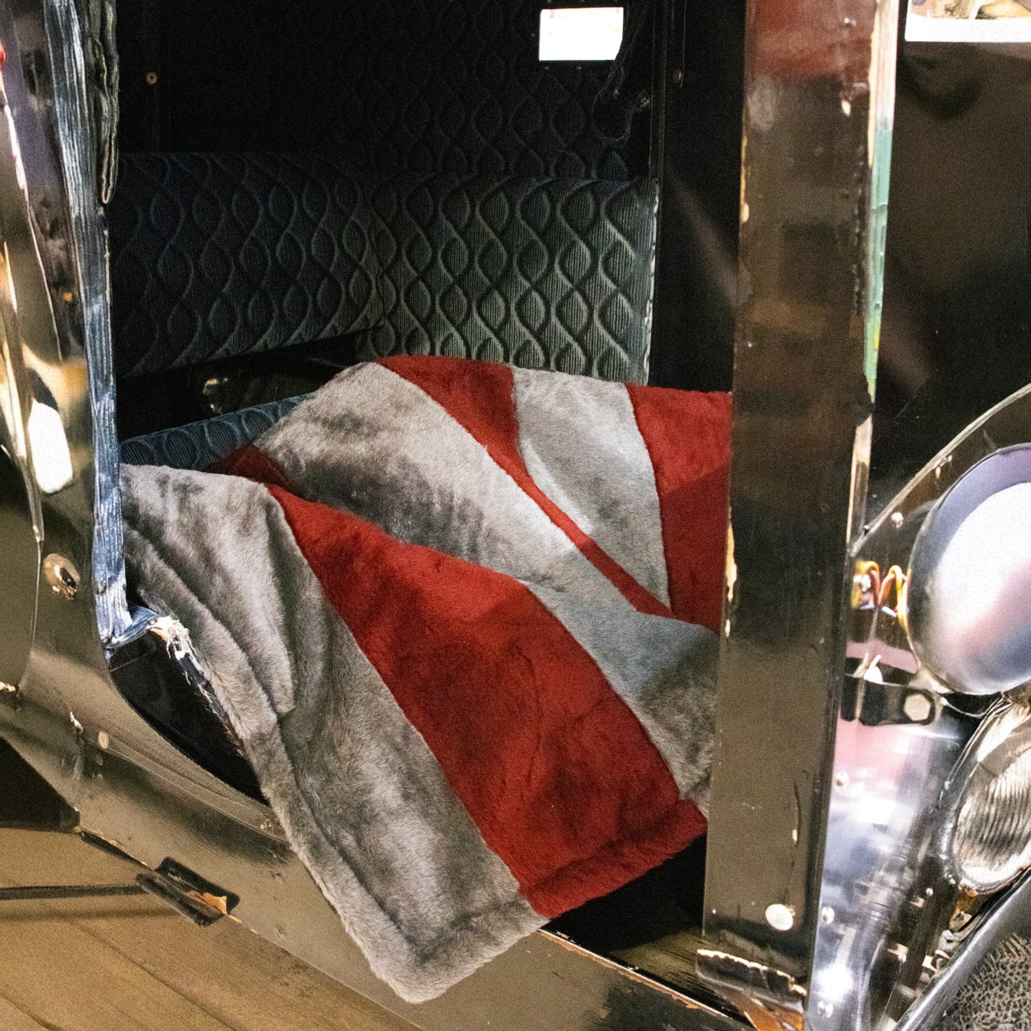 Soft, handcrafted Amish-made lap robe with plush warm faux fur in red and gray stripes, featuring quilted lining, perfect for Home & Decor and USA Made collections.