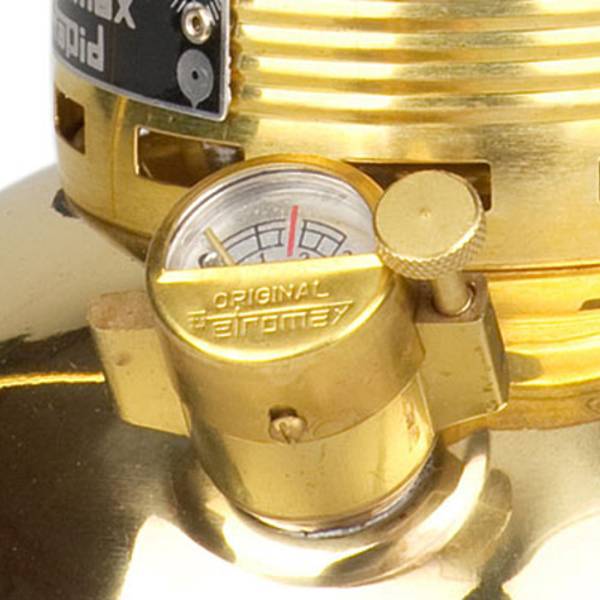 Close-up of the pressure gauge on a brass kerosene lamp, designed for reliable lighting in camping, emergency supplies, and outdoor collections.