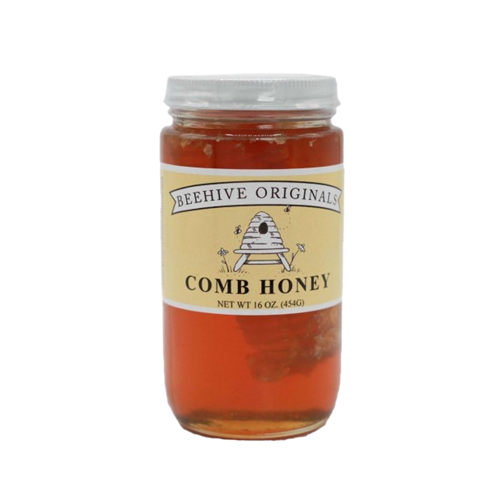 Clear glass jar of raw comb honey with visible honeycomb inside, featuring a beige label with rustic bee and hive illustration, made in USA, ideal for Kitchen & Food, Pantry, and Best Sellers collections.