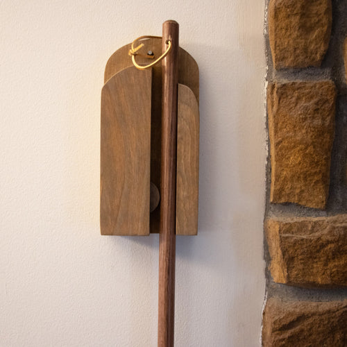 Handcrafted Amish made wooden wall-mounted broom holder in rich natural finish, featuring a sliding ball mechanism for secure broom storage, ideal for Home & Decor and Household Helpers collections.