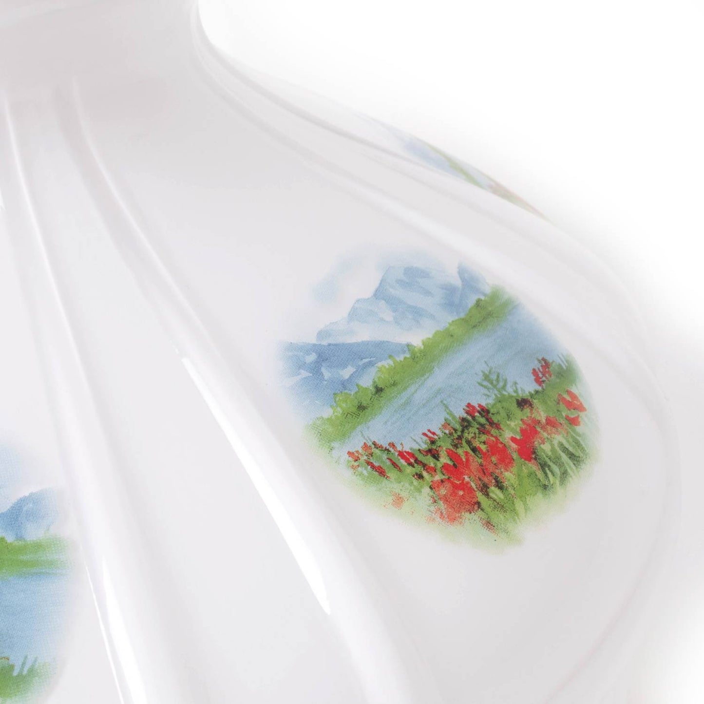 Close-up of a handcrafted 10-inch glass lamp shade featuring an Alpine Meadow design with soft floral and mountain details, ideal for lamps & lighting and accessories collections.