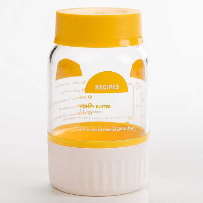 Clear plastic butter maker jar with yellow lid and white base featuring easy-to-follow honey butter recipe and measurement markings, part of Farm, Garden & Tool, Kitchen & Food, Specialty Equipment, Making Butter, Best Sellers, Homesteading, and Promo Eligible collections.