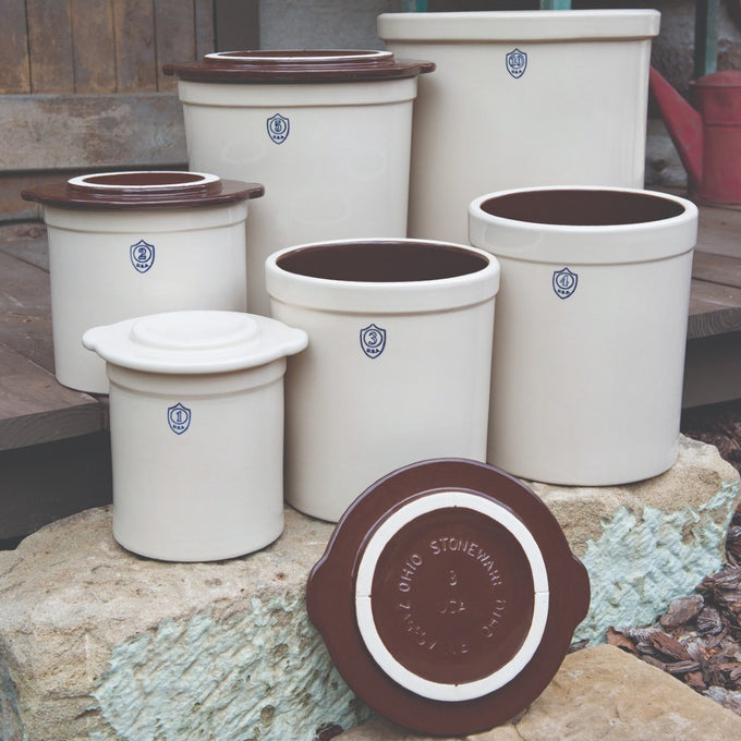 Group of handcrafted stoneware crocks with smooth glazed interiors and off-white exteriors, numbered and made in USA, ideal for Kitchen & Food, Food Preservation, and Fermenting and Pickling collections.