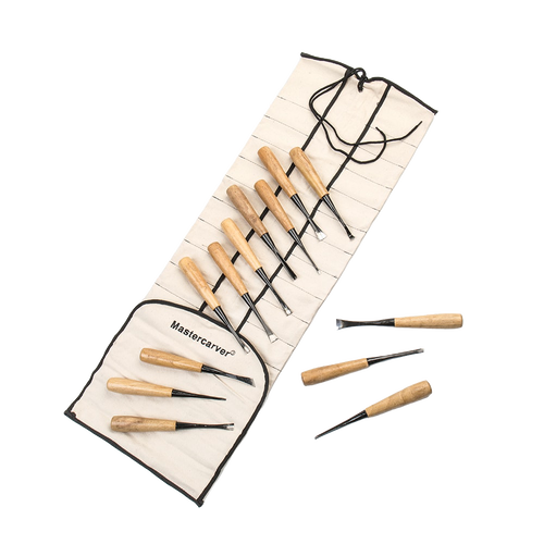 Set of 13 hand-forged wood carving tools with wooden handles arranged in a heavy-duty canvas roll, suited for farm, garden, and hand tool collections including knives and axes.