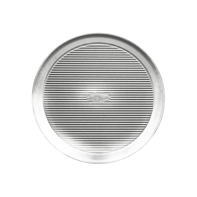 12-inch round aluminized steel pizza pan with fluted surface for even baking and crispy crusts, crafted in the USA, part of Kitchen & Food, Cookware, and Baking Supplies collections.