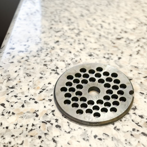 Handcrafted steel chopper plate with a pattern of circular holes, made in USA, ideal for Kitchen & Food, Specialty Equipment, Butchering Supplies, USA Made, Best Sellers, and Promo Eligible collections.