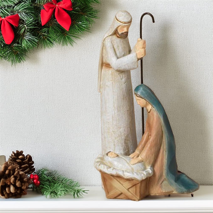 Unique handcrafted resin nativity figurine of the Holy Family with Joseph standing, Mary kneeling beside baby Jesus in a manger, perfect for Home & Decor, Holiday Decor, Best Sellers, Promo Eligible collections.