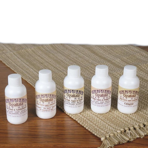 Set of five small handcrafted cologne and aftershave bottles featuring classic Bay Rum scents, displayed on a woven natural fiber runner for Grooming and Personal Hygiene, Health & Wellness, and USA Made collections.