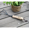 Handcrafted garden cultivator with three black steel tines and a smooth wooden handle featuring a leather hanging loop, ideal for Farm, Garden & Tool and Digging and Cultivating collections.