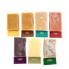Seven handcrafted natural soap bars in assorted colors and scents, each labeled with names and packaging tags, featured in Health & Wellness, Soaps and Soapmaking, USA Made, and Best Sellers collections.