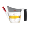 Clear plastic fat separator with gray top and cushioned black grip handle, featuring red stopper and measurement markings, designed for Kitchen & Food, Cooking Helpers, and Best Sellers collections.