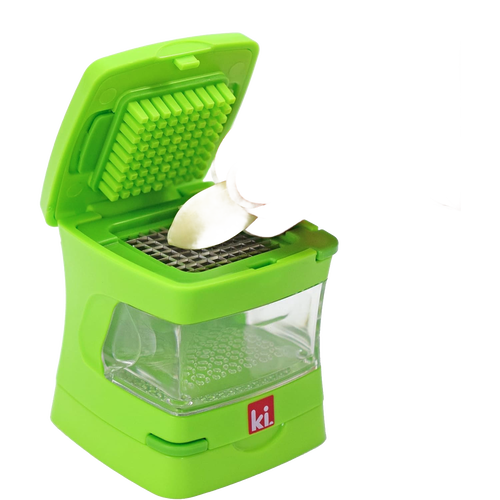Compact green garlic prep tool with built-in stainless steel blades and clear container, designed for easy peeling, slicing, mincing, and grating, ideal for Kitchen & Food and Food Prep collections.