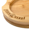 Handcrafted bamboo lantern coaster with engraved flame logo and Feuerhand name, designed to protect surfaces from oil residue, ideal for camping, emergency supplies, and lighting collections.