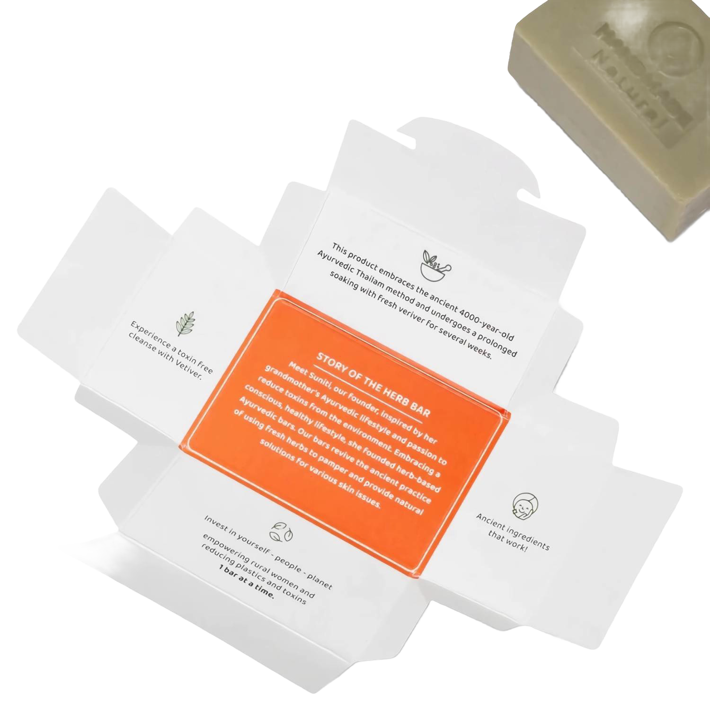 Open soap packaging with detailed text highlighting Ayurvedic tradition, ancient natural ingredients, and sustainable care for skin and environment, accompanied by a handcrafted soap bar rich in organic coconut oil, featured in Health & Wellness, Soaps, Best Sellers, and Promo Eligible collections.