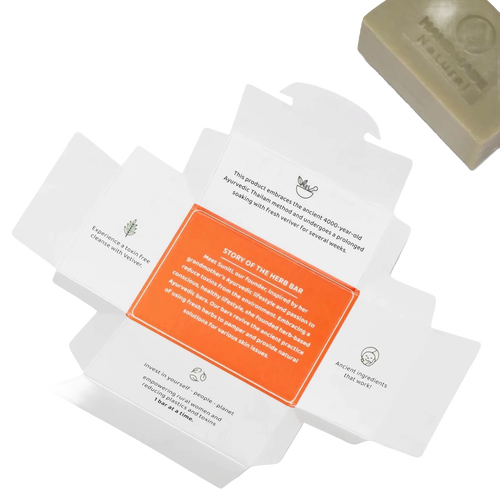 Open soap packaging with detailed text highlighting Ayurvedic tradition, ancient natural ingredients, and sustainable care for skin and environment, accompanied by a handcrafted soap bar rich in organic coconut oil, featured in Health & Wellness, Soaps, Best Sellers, and Promo Eligible collections.